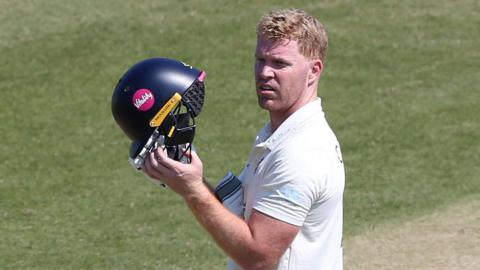 Kent's Ben Compton holding his batting helmet