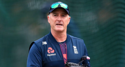 An image of former England and Surrey cricketer Graham Thorpe. He is wearing a new balance gilet with England and Natwest emblems. He is wearing a cap and sunglasses.
