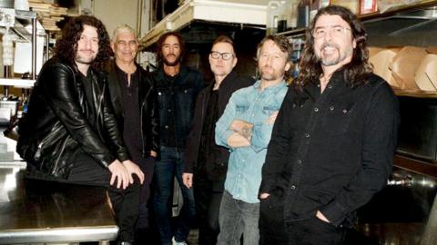 The Foo Fighters posing a promo shoot 