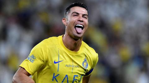 Cristiano Ronaldo celebrates scoring for Al Nassr in a match in May 2024 against Al Wehda at Al-Awwal Stadium in Riyadh, Saudi Arabia