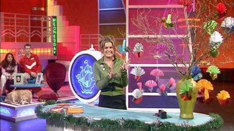 Katy Hill on the set of Blue Peter showing off many bird decorations