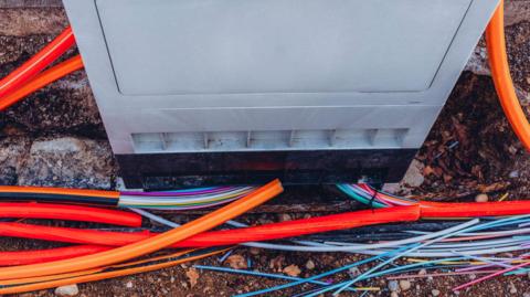 A junction box at a construction site that is intended for the installation of high speed internet access via fibre optic cables. 