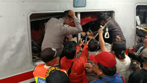 Evacuation of passengers on the train involved in an accident at East Bekasi Station, near Jakarta, Indonesia