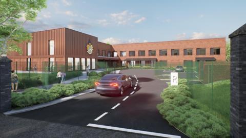 A computer-generated image of a new primary school. A red brick two-story building with a car park in front and low, green shrubs on either side. A car is being driven into the car park.