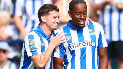 Jamal Lowe (right) and Louie Barry celebrate after Lowe's goal against Bolton