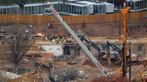 Construction crews and vehicles the White House ballroom site. 