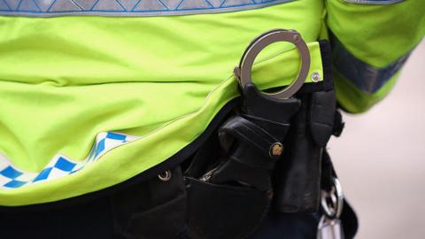 Handcuffs in a police officer's pocket