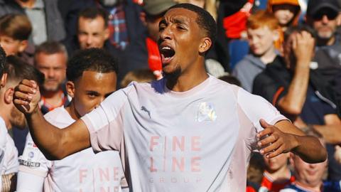 Bradley Ibrahim celebrates one of his two goals at Luton Town