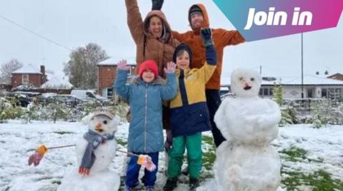 family with snowman