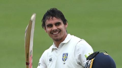 Durham batter David Bedingham celebrates reaching his century during day one of the County Championship Division Two match between Durham and Worcestershire at Seat Unique Riverside 