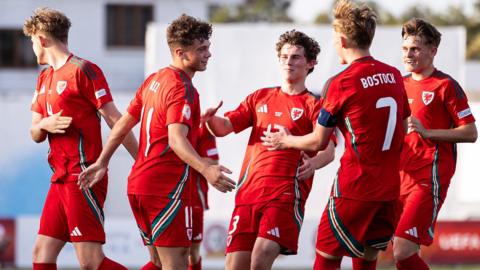 Wales players celebrate after Cruz Allen's equaliser against Croatia