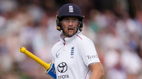 Joe Root walks off