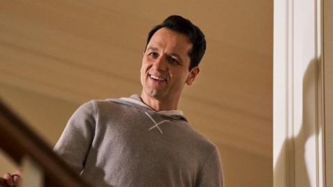 Matthew Rhys as Nile Jarvis in The Beast In Me peers down the staircase