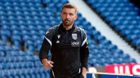 James Morrison walking in the stadium