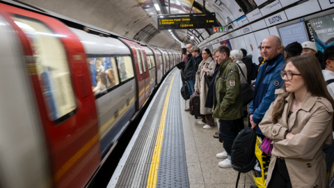 People waiting for a train on london underground