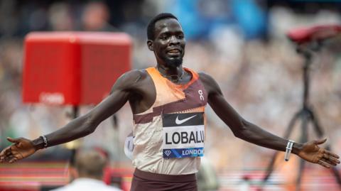 Dominic Lobalu running through the finish line at the London Diamond League meet in July. 