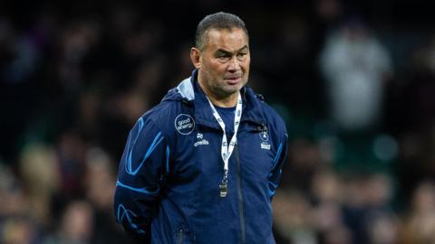 Pat Lam standing with his hands behind his back on the pitch during a pre-game warm-up with Bristol at the Principality Stadium