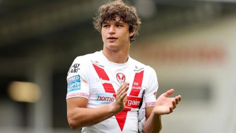 Harry Robertson of St Helens applauds the fans