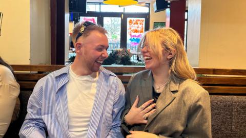 Two young teachers laughing together