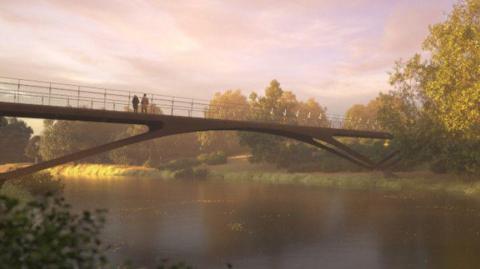 An artist's impression of a brown footbridge with silver railings over a river. Two people are standing on the bridge looking out at the water. A river bank with multiple trees is visible across the river.