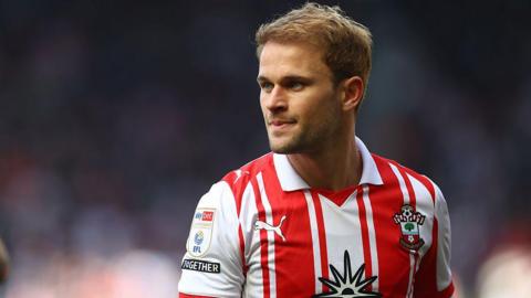 Leo Scienza wearing his red and white Southampton shirt