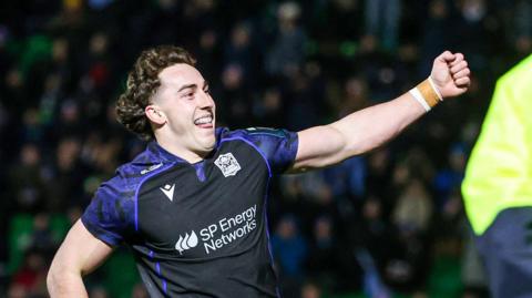 Josh McKay celebrates scoring a try for Glasgow Warriors