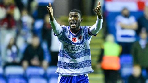 Kelvin Ehibhatiomhan thowing arms up in consternation, wearing Reading home kit