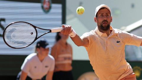 Novak Djokovic hits a forehand