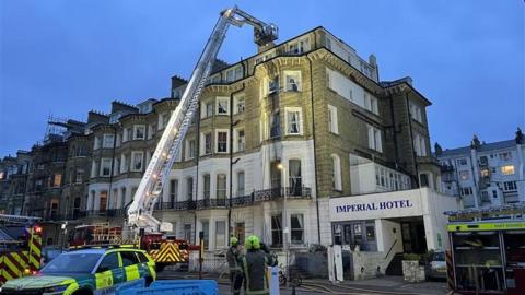 An aerial ladder platform being used on a Victorian building.