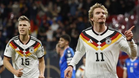 Nick Woltemade celebrates scoring for Germany against Slovakia in World Cup qualifier