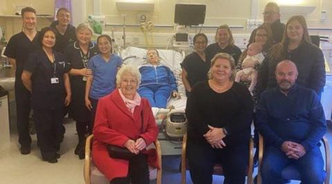 Hospital staff with the training dummy and fundraisers