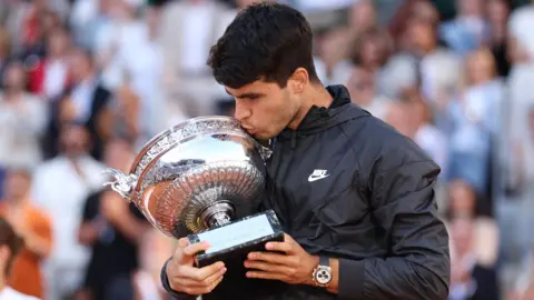 Carlos Alcaraz with the French Open trophy