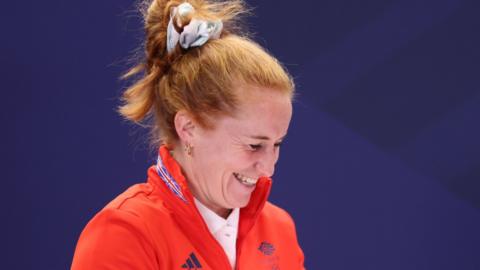 Sarah Jones laughing in Team GB Olympic tracksuit