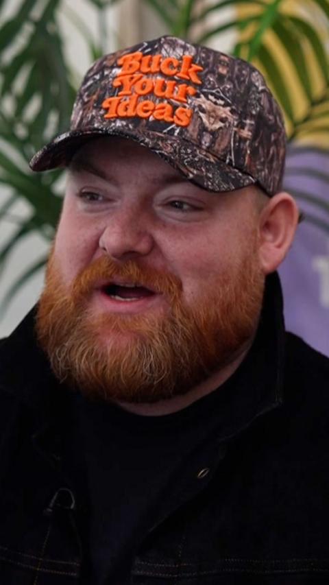 Man with ginger beard and cap on