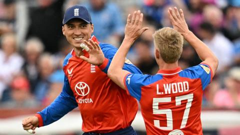 England players celebrate a wicket