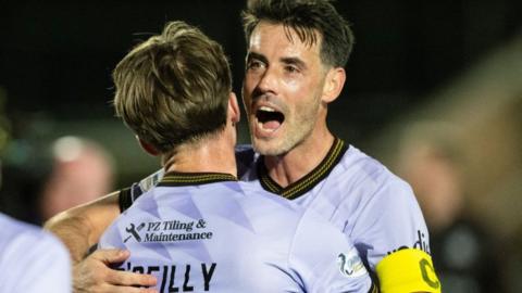 Partick Thistle player-boss Brian Graham celebrates