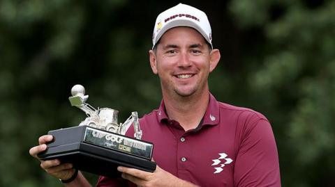 Lucas Herbert of Australia poses with his individual trophy after the final round of LIV Golf United Kingdom