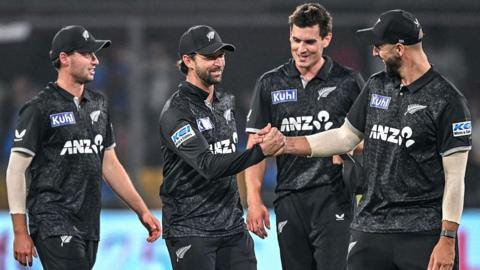 New Zealand players celebrate after winning the third one-day international against India to clinch the series