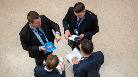 Four men in discussion at the Conservative Party Conference in Birmingham last week