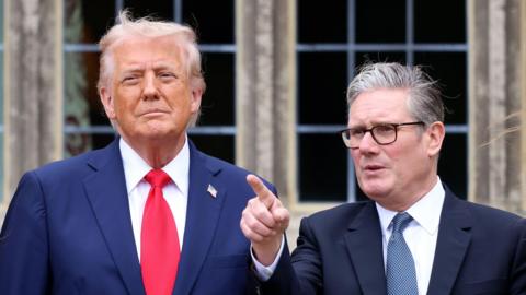 US President Donald Trump (L) with British Prime Minister Sir Keir Starmer (R) as they look at a Red Devils air display at Chequers in Buckinghamshire, Britain, 18 September 2025.