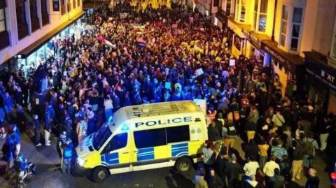 People rallying in Brighton city centre