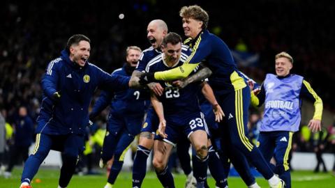 Scotland players celebrate Kenny McLean scoring the team's fourth goal during the Fifa World Cup European Qualifying match at Hampden Park, Glasgow, in November.