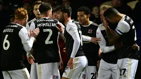 Exeter City celebrate a goal