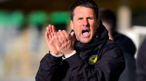 Jimmy Ball encourages his Torquay team from the sidelines