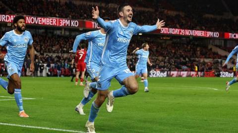 Liam Kitching runs away to celebrate after scoring his second at Middlesbrough