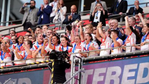 St Helens lift the Women's Challenge Cup trophy