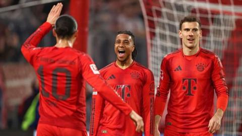 Michael Olise, Leroy Sane and Leon Goretzka all celebrate Bayern Munich's goal