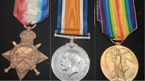 A collage of World War One 1914-15 Star, British War Medal and World War 1 Victory Medal against a black background.