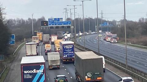 The M60 taken from a bridge over the motorway showing traffic on the anti-clockwise side but no traffic in the clockwise direction following a serious crash.