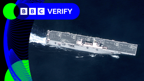 A large Chinese warship that has six helicopter landing pads as seen in a satellite image